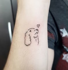 a dog with a heart tattoo on its arm