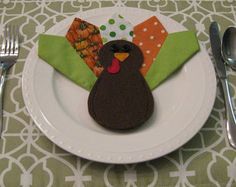 a white plate topped with a turkey shaped cookie