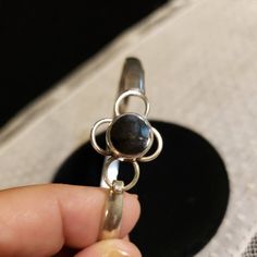 "Classic polished flat Silver Bangle featuring a 10mm round BLACK ONYX at the top, over a scalloped design. Flexes open and closed, with a tension catch (see photos) 5.2mm Wide 12.5 Grams 7.5\" (2 9/16\" across the bracelet interior) Hallmarked 925 THAILAND Contact me with any questions" Polished Black Bracelets, Classic Black Bangle As Gift, Handmade Black Round Bangle, Homemade Pendant, Scalloped Design, Silver Bangle Bracelet, Sterling Silver Bangle Bracelets, Sterling Silver Bangle, Onyx Bead