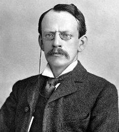 an old black and white photo of a man with a moustache on his face