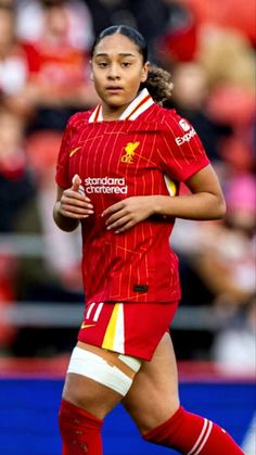 a female soccer player in action on the field