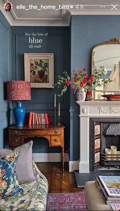 a living room filled with furniture and a fire place in front of a painting on the wall