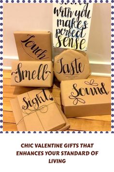 four gift boxes with the words smile, taste, and sound written on them in black ink