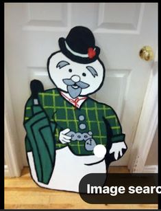 a door with an image of a man in a green coat and top hat on