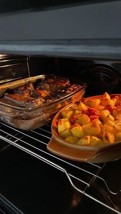 two trays of food are cooking in the oven