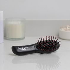 Experience luxurious relaxation with Zadro's Feelz Good Massaging Hair Brush - a compact, battery-operated tool that provides dual-speed vibration and enhanced styling capabilities. The built-in massage technology relaxes stress and tension, while the unique nodules stimulate circulation and generate charged ions to give your hair a thicker, fuller appearance. Detangle strands and enjoy a soothing massage - seriously! Generates charged ions that give your hair a thicker fuller appearance Detangl Detangling Hair, Detangling Hair Brush, Shop Makeup, Hair Detangler, Hand Held Shower, Makeup Mirror, Hair A, Hair Brush, Battery Operated