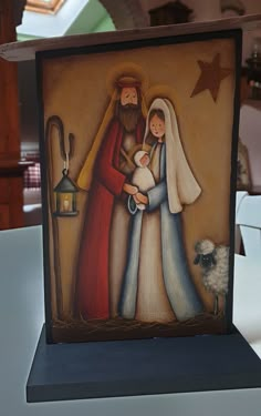 an image of a nativity scene with jesus and mary holding a baby jesus in his arms