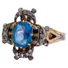 Antique 14k gold ring centered with 1 natural sky blue sapphire stone with a diameter 6mm×6.75mm flanked with little rose cut diamonds in detailed prongs workmanship ring was made in europe 1850/1880.c Blue Sapphire Stone, Diamond Gold Ring, Diamond Gold, Sapphire Stone, 14k Gold Ring, Gold Diamond Rings, Rose Cut Diamond, Cocktail Rings, Rose Cut