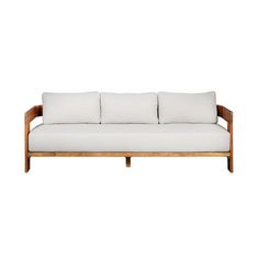 a white couch sitting on top of a wooden frame