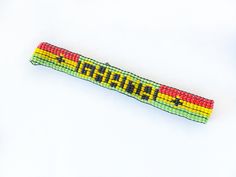 Crafted with care and attention to detail, the bracelet features a striking combination of black, green, red and yellow beads arranged in the iconic Ghana flag pattern. It is long-lasting, adjustable and designed for comfortable wear all day long. available in various sizes.   Wear this eye-catching bracelet with casual outfits, on special occasions, or as a statement piece to show your support for Ghanaian culture, sports teams, or national events. It's perfect for anyone who loves bold, colorf Beaded Bracelet Angolan Flag, Angolan Flag African Bracelets, Ghanaian Culture, Ghana Flag, Flag Bracelet, Flag Pattern, Colorful Accessories, Wrist Band, Bracelet Beaded