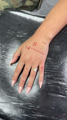 a woman's hand with red ink on it