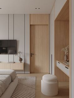 a bedroom with white walls and wooden furniture