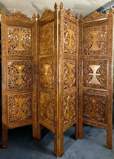 an intricately carved wooden room divider