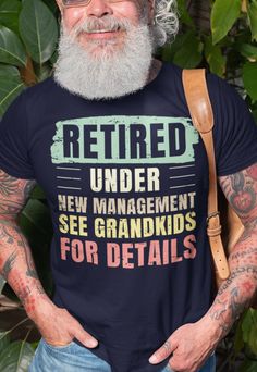 a man wearing a t - shirt that says retired under new management see grandkids for details