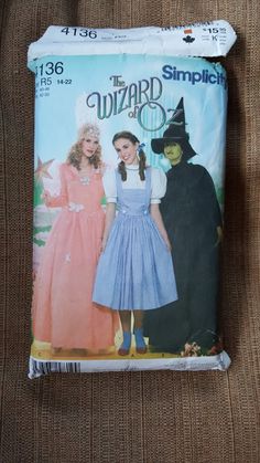 the wizard and the witch costume sewing pattern is shown on top of a piece of fabric