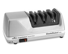 a silver and black toaster sitting on top of a counter