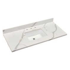 a white bathroom sink sitting on top of a marble countertop next to a faucet