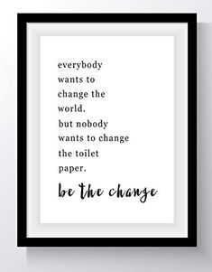 a framed black and white poster with the words be the change in cursive writing