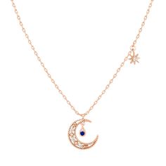 Dream off to space in our dazzling Blue Moon Necklace. With its intricate design and pops of blue, these beauties will leave everyone star struck. 18k gold plated, 18k rose gold plated, or rhodium plated over brass Cubic zirconia stones 15" with a 2" extension Get the matching earrings Want to know how to take care of your jewelry? Click here Celestial Rose Gold Moon Phase Necklace, Rose Gold Celestial Necklace With Moon Phase, Celestial Rose Gold Necklace With Moon Phase, Elegant Moon Phase Necklaces For Party, Celestial Rose Gold Necklace With Moon Charm, Blue Moon Charm Necklaces For Gifts, Blue Moon Charm Necklace Gift, Blue Moon Charm Necklace For Gift, Elegant Blue Moon-shaped Jewelry