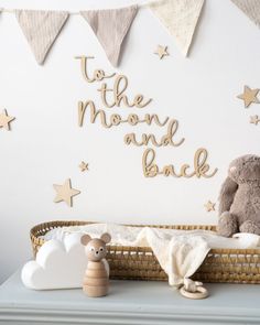 Neutral nursery changing table with the wooden wall quote 'to the moon and back' laser cut from birch plywood in a script style font with wooden stars scattered around the words, laser cut in the UK by bobo and the mouse. Boho Theme Nursery, Luna Nursery, Moon And Back Nursery, Organization Nursery, Star Themed Nursery, Nursery Makeover, Stars Nursery, Baby Luna, Clouds Nursery