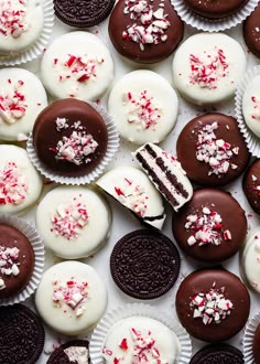 chocolate and white desserts with sprinkles are arranged in rows on top of each other