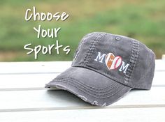 a baseball cap with the words choose your sportss on it sitting on a bench