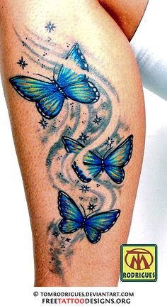 a woman's thigh with blue butterflies on it