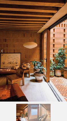 an image of a living room with wood paneling