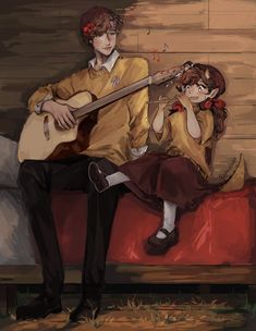 a man sitting on top of a red couch next to a woman holding a guitar