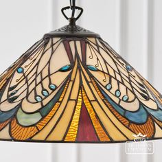 a stained glass lamp hanging from the ceiling