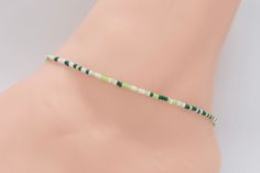 Beach Anklet, Beaded Anklet, Anklet Jewelry, Ankle Bracelet, Boho Anklet, Hippie Anklet, Gift For Her, Women's, Green Anklet, White  Anklet Dainty anklet is made with 11/0 Czech seed beads in different shades of green and white, with 2mm silver filled beads with a lobster clasp.  All items in my store are made buy me. Please send me a message if you want a custom order or need a size that is not listed in the drop down menu.  Size: Measure your anklet above the anklet bone with measuring tape. W Casual Cheap Colorful Beaded Anklets, Cheap Handmade Green Anklets, Casual Green Anklets, Green Beaded Summer Anklets, Green Beaded Anklets With Round Beads, Hippie Adjustable Anklets For Beach, Adjustable Green Anklets With Tiny Beads, Handmade Adjustable Hippie Anklet, Diy Friendship Bracelets Tutorial