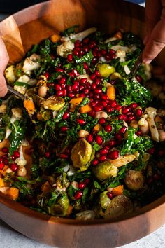 Close up of roasted vegetables and pomegranates in a wooden bowl Pomegranate Sweet Potato Salad, Fall Pomegranate Salad, Thanksgiving Salad With Pomegranate, Thanksgiving Salad Pomegranate, Salad With Pomegranate Seeds, Fall Harvest Salad, Autumn Vegetables, Thanksgiving Salad Recipes