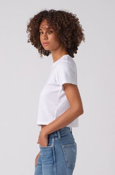 Because you need the perfect boxy, cropped tee to pair with high-waisted jeans. Featuring our signature double needle side seam detail, tonal topstitching, and subtle distressing around edges for a worn-in feel. COLOR: WHITE FIT & MEASUREMENTS: Length = 19 1/2" Cropped, shrunken fit Measurements taken from size Small Talhia is wearing size Small and is 5'10" Fits true to size Fabric & Care: 100% Cotton Machine wash cold, tumble dry low heat Made with love in Los Angeles White Cutoff Tops With Frayed Hem, Cropped Boxy Fit T-shirt, Boxy Fit Cropped T-shirt For Everyday, Boxy Fit Cropped Shirt For Everyday, Everyday Boxy Fit Cropped Shirt, Everyday Boxy Fit Cropped T-shirt, Everyday Cropped T-shirt For Spring, Trendy Cutoff Tops For Everyday, Boxy Cropped Crop Top