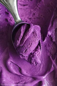 a scoop of purple ice cream in a bowl