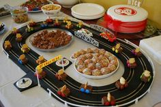 a table topped with lots of different types of foods and desserts on top of it