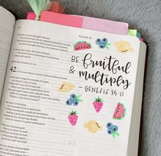 an open bible with fruit and leaves on the pages that read be fruitful and medley