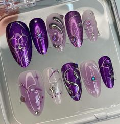 💜✨ Mystic Purple Passion Press-On Nail Set | Luxurious Almond & Stiletto Nails with Sparkles and Charms ✨💜 Transform your nails into a canvas of mystical charm with our Mystic Purple Passion Press-On Nail Set. From deep violets to soft lilacs, each nail is a work of art, featuring intricate designs and luxurious embellishments that are sure to captivate. 🔮💅 Key Features & Highlights: Vibrant Purple Shades: Dive into a spectrum of purple, with each nail showcasing a different hue from enchant Gem Acrylic Nails, Swift Nails, Almond Stiletto, Bday Nails, Nails Luxury, Purple Nail Designs, Cherry Nails, Chrome Nail, Nails Today