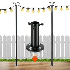 a black pole with some lights on it in front of a fence and wooden floor