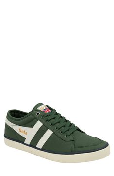 Contrasting stripes refine a comfy, versatile canvas sneaker set on a durable rubber sole. Lace-up style Textile upper and lining/rubber sole Imported Green Textile Sneakers With Vulcanized Sole, Green Sporty Canvas Shoes With Vulcanized Sole, Sporty Green Canvas Shoes With Vulcanized Sole, Green Casual Sneakers In Textile, Casual Green Cotton Sneakers, Green Cotton Sneakers With Vulcanized Sole, Green Cotton Sneakers With Rubber Sole, Green Canvas Shoes With Gum Sole, Sporty Lace-up Sneakers With Canvas Lining