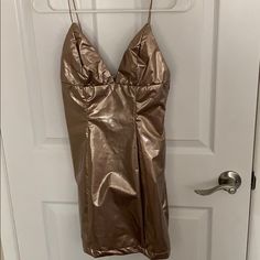 Bronze Shiny Color. Brand New With Tags Never Worn. So Cute And Fun!! Make Me A Reasonable Offer! I Paid Full Price + Shipping On This. Gold Glamorous Mini Dress For Going Out, Glamorous Gold Mini Dress For Going Out, Forever 21 Spaghetti Strap Mini Dress For Date Night, Lined Backless Mini Dress For Party, Gold Mini Dress For Going Out, Backless Lined Mini Dress For Party, Gold Mini Dress For Date Night, Dressy Gold Mini Dress For Summer, Forever 21 Spaghetti Straps Mini Dress For Night Out