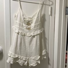 White Romper With Bows And Ruffles. Brand New With Tags! So Cute For The Summer, Day Parties! Size Medium (Us) Size 10 (Au) For Guidance, I Am 130 Lbs , 5’3 And Fits So Cute! White Summer Jumpsuits And Rompers With Ruffles, White Ruffled Jumpsuits And Rompers For Vacation, Casual White Jumpsuits And Rompers With Ruffles, Rompers Outfit, Leslie White, Cute Jumpsuits, Skort Romper, Selfie Leslie, 130 Lbs