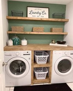 a washer and dryer in a laundry room with shelves above them that are open