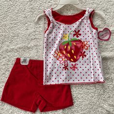 Little Girls Strawberry Shorts Outfit Pull On Red Shorts With Elastic Back Top Is Red And White Polkadot Layered Look With Glittery Strawberry And Flowers By Young Hearts Red Cotton Short Sets, Red Short Sets For Spring, Playful Red Bottoms For Spring, Red Cotton Beach Sets, Red Cotton Beachwear Sets, Red Summer Playwear Sets, Red Playwear Sets For Summer, Red Bottoms For Spring Playwear, Red Bottoms For Playtime In Spring