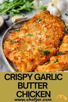 crispy garlic butter chicken on a plate with herbs and garlic in the background text reads crispy garlic butter chicken