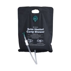 the solar heated camp shower is shown in front of a black bag with a green handle