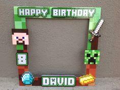 a photo frame made to look like an 8 - bit video game character