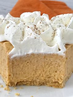 a slice of pumpkin pie with whipped cream on top