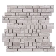 a white brick wall with grey and gray bricks on it's sides, all lined up in rows