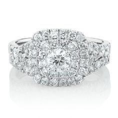 a diamond ring with two rows of diamonds on the band and one row of round brilliant cut