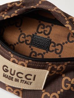 Instantly recognisable, Gucci's belt bag features the house's iconic motif printed all-over and a logo patch appliquéd on the front. It's made from ripstop and has an adjustable leather strap, so you can wear it cross-body. Luxury Shoulder Bag With Logo Print For Travel, Luxury Logo Print Shoulder Bag For Travel, Brown Rectangular Bag With Embroidered Logo, Brown Travel Bag With Embroidered Logo, Brown Leather Gucci Belt Bag, Rectangular Shoulder Bag With Designer Logo For Travel, Designer Brown Bags With Embroidered Logo, Designer Logo Rectangular Shoulder Bag For Travel, Rectangular Travel Shoulder Bag With Designer Logo